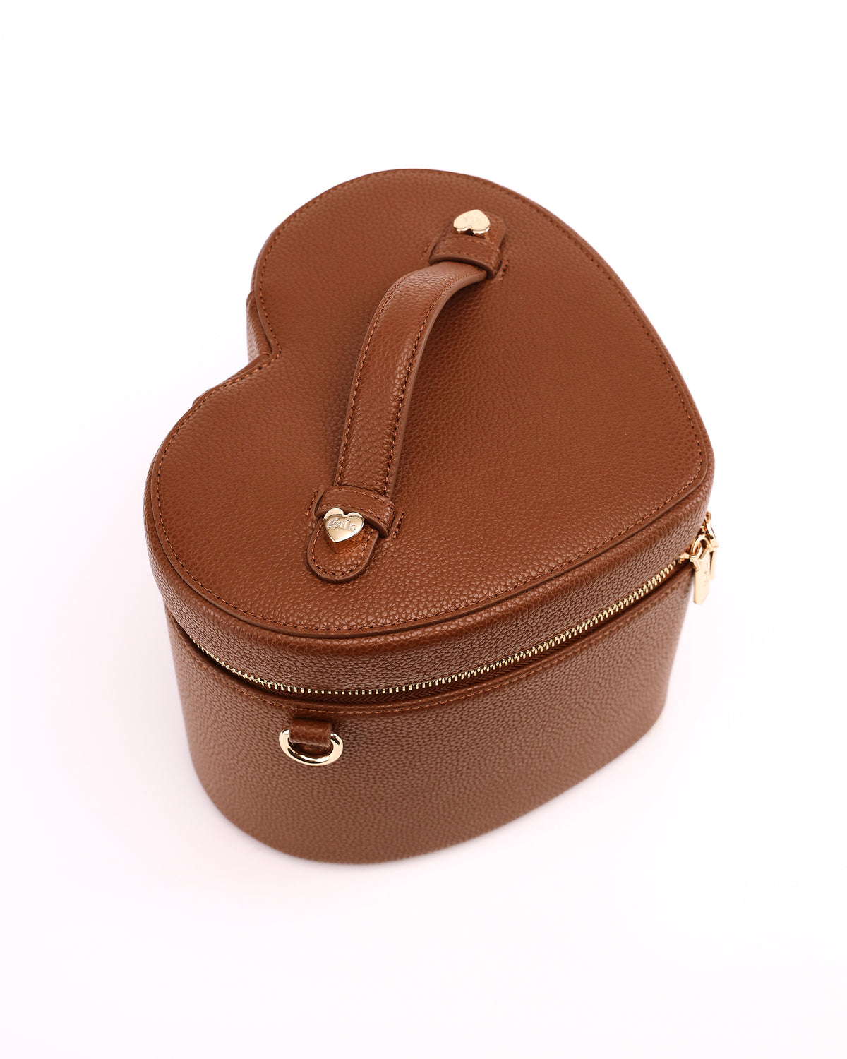 Top view of the heart-shaped lid and handle on GALS Mini Lovette Vanity Case in Mocha