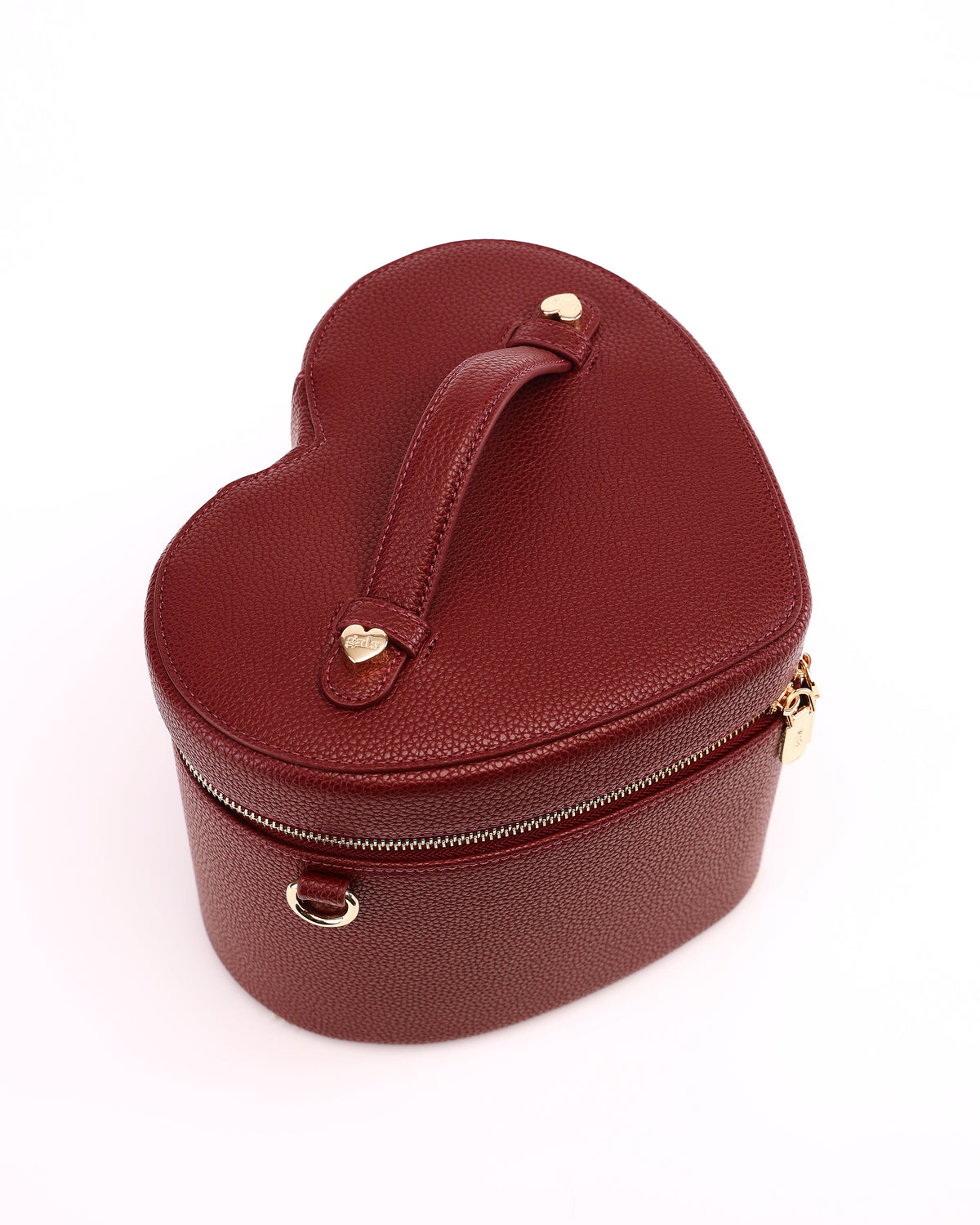 Top view of the heart-shaped lid and handle on GALS Mini Lovette Vanity Case in Mulberry