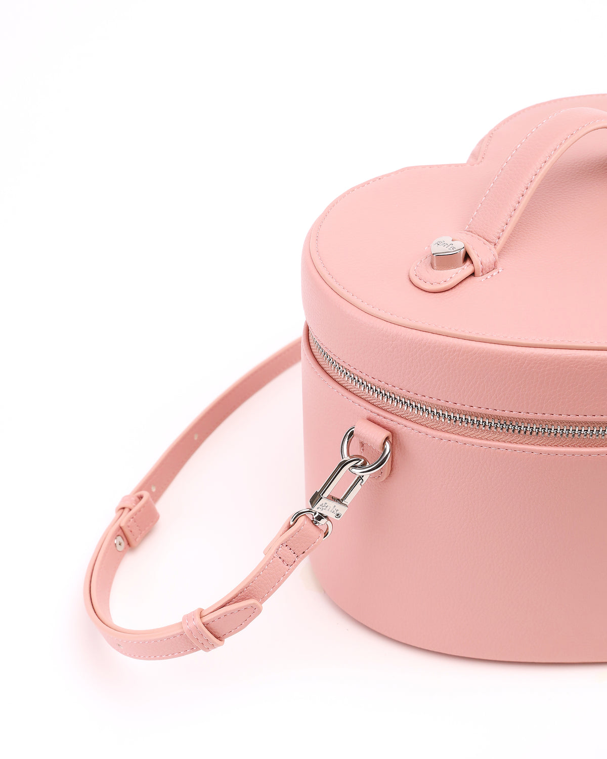 Close-up of the strap attachment and hardware on GALS Mini Lovette Vanity Case in Blush Pink